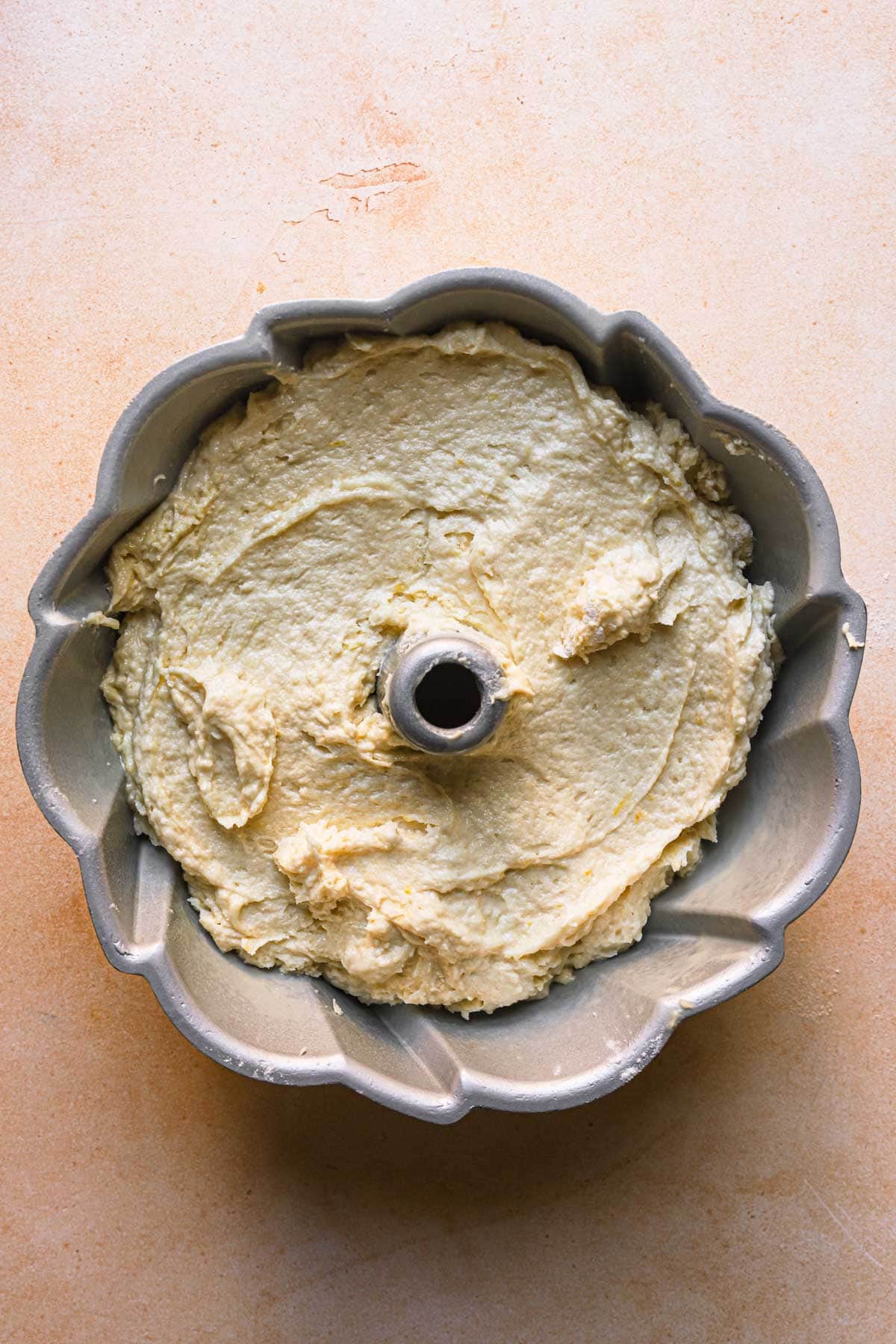 A bunt pan with cake batter.