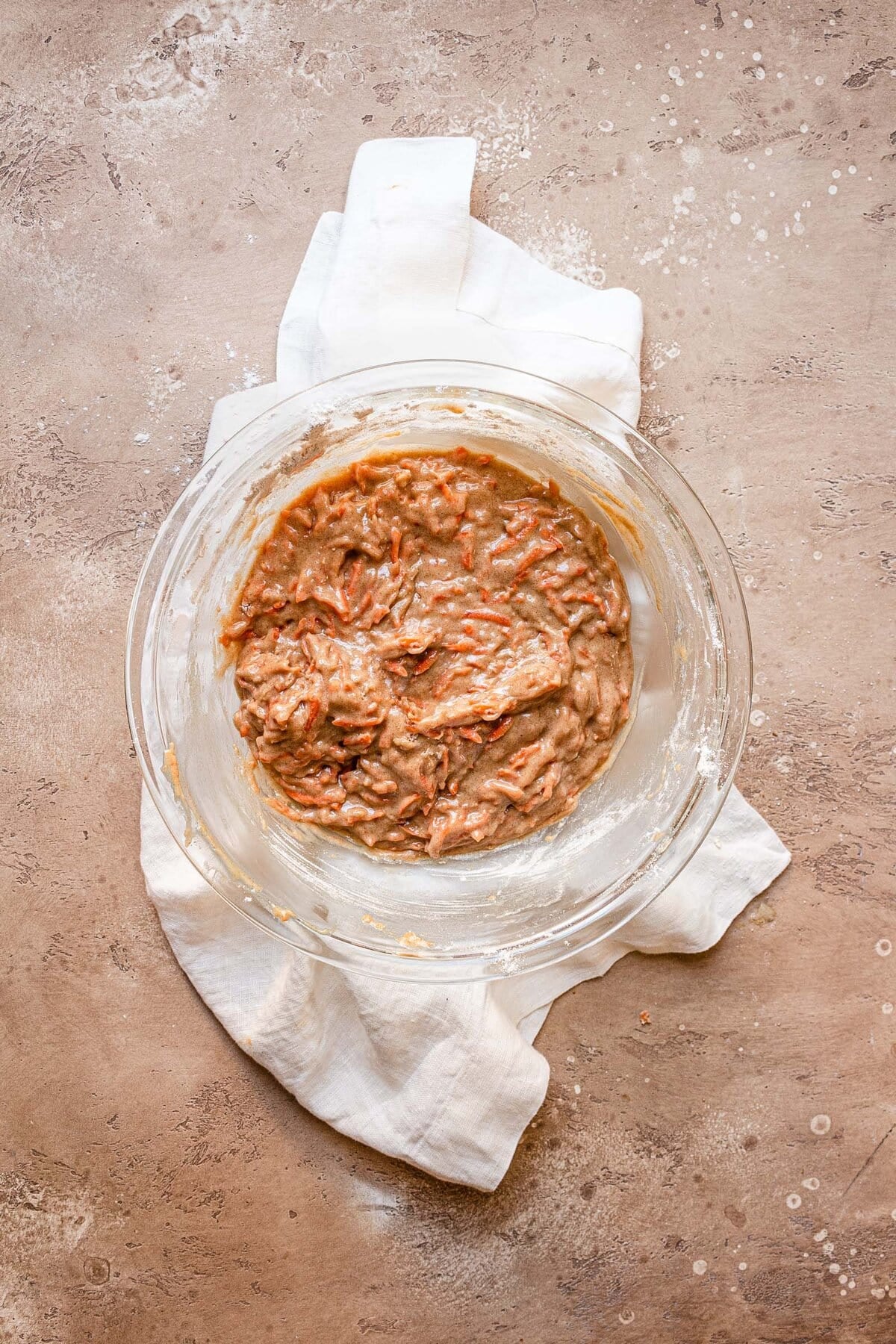 A large bowl with carrot muffins batter.