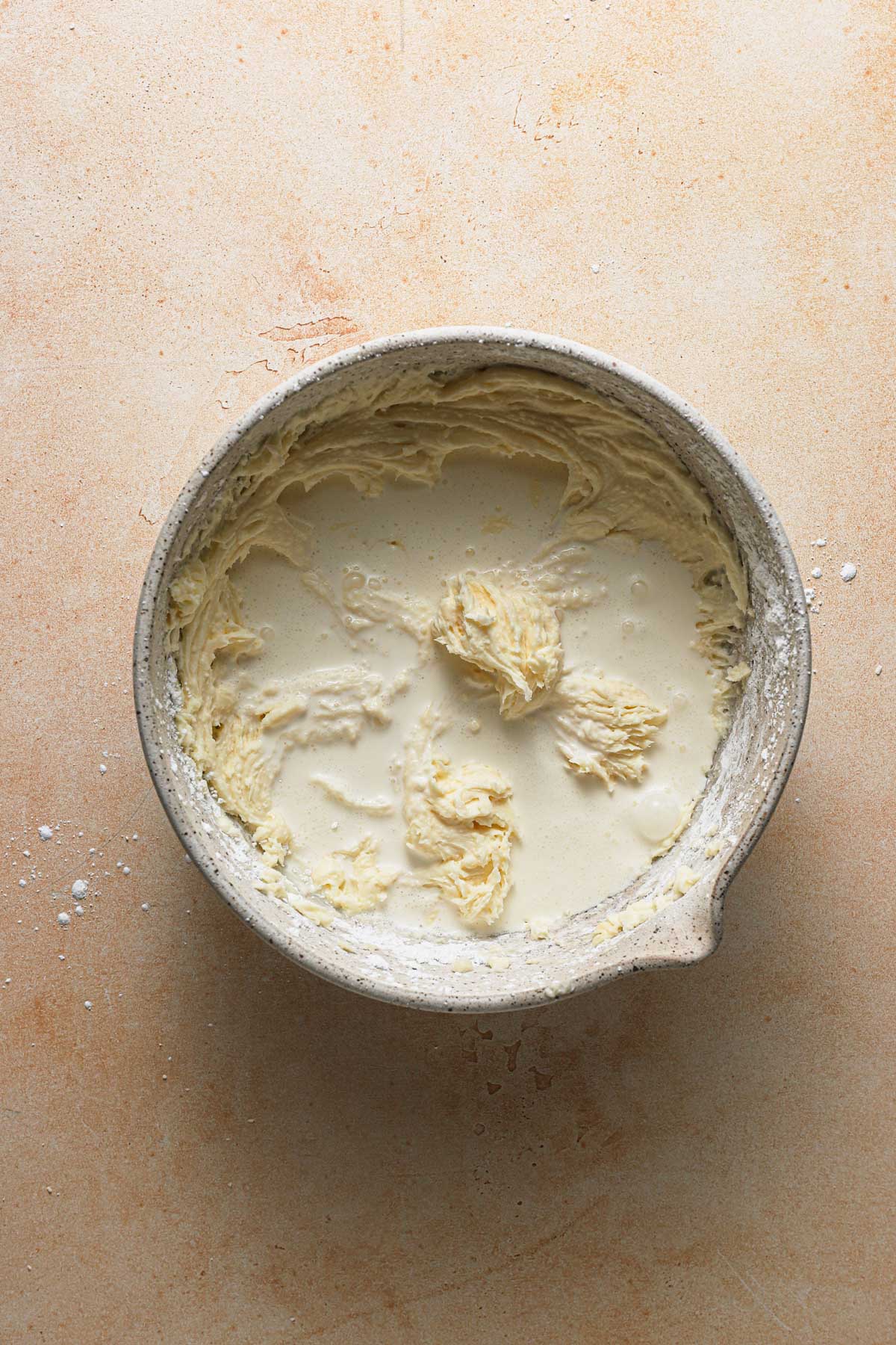 A bowl with creamed mascarpone and heavy cream.