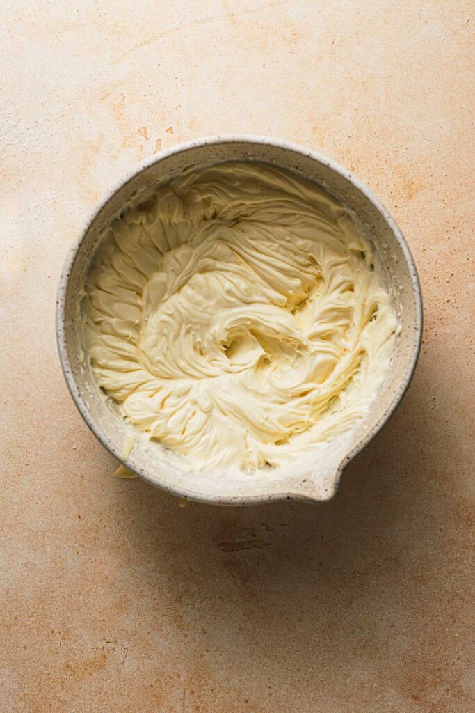 A large bowl with creamy mascarpone cream.