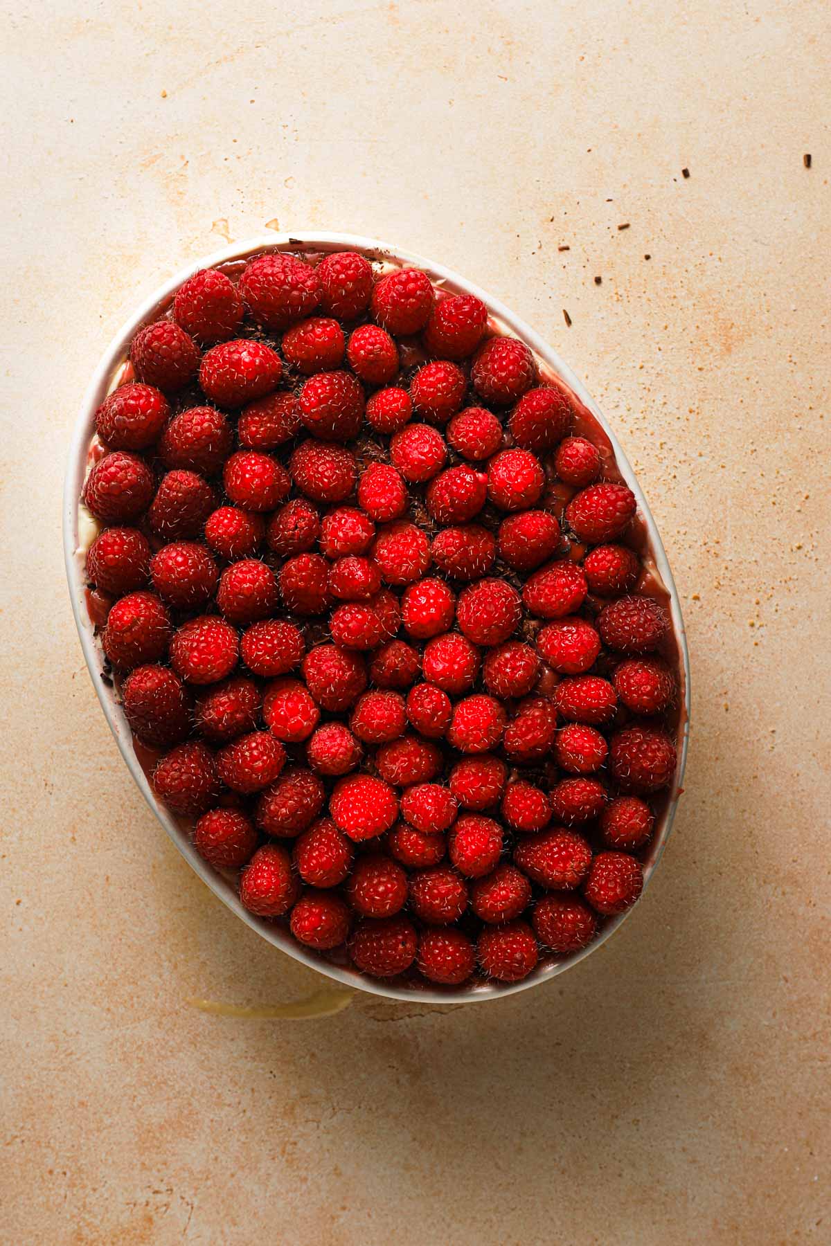 An oval dish with fresh raspberries.