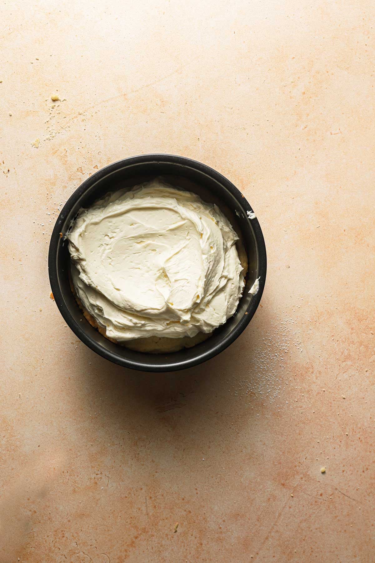 A pan with cheesecake filling.