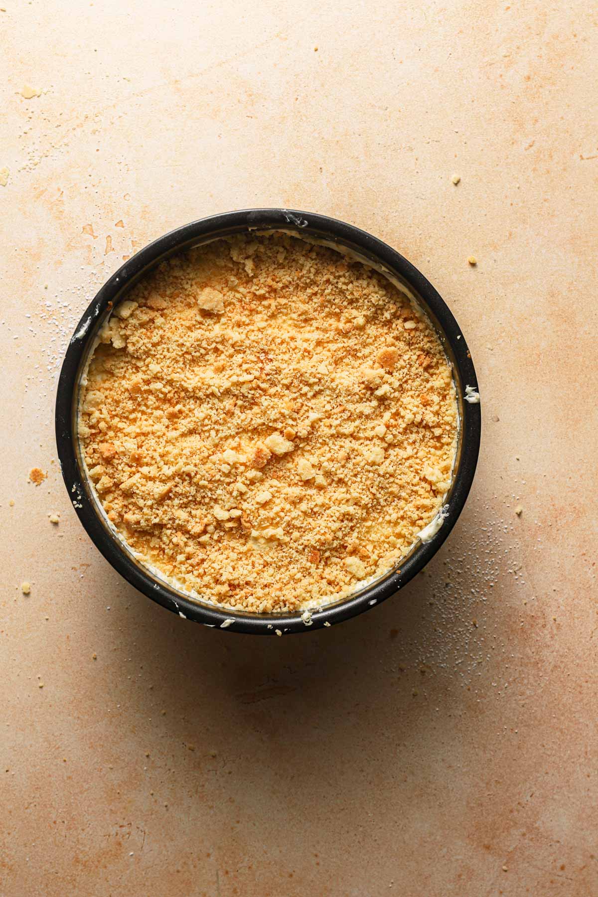 An israeli crumbs cheesecake in a pan.