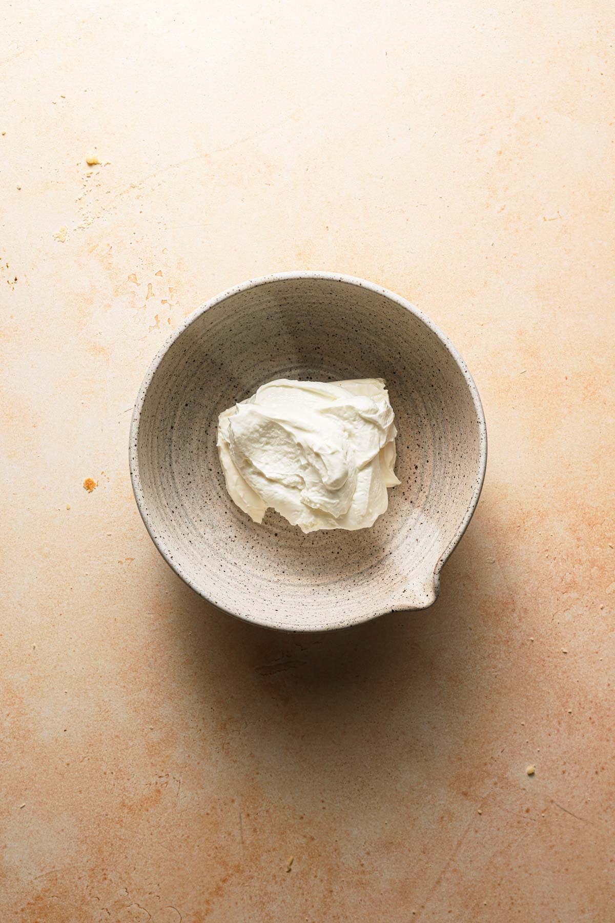 A large bowl with cream cheese.