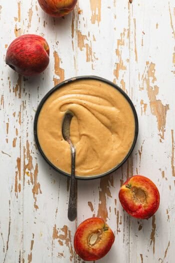 a bowl with curd and a spoon.