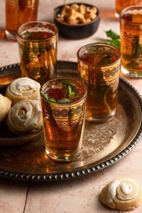 tea cups with cookies and nuts.