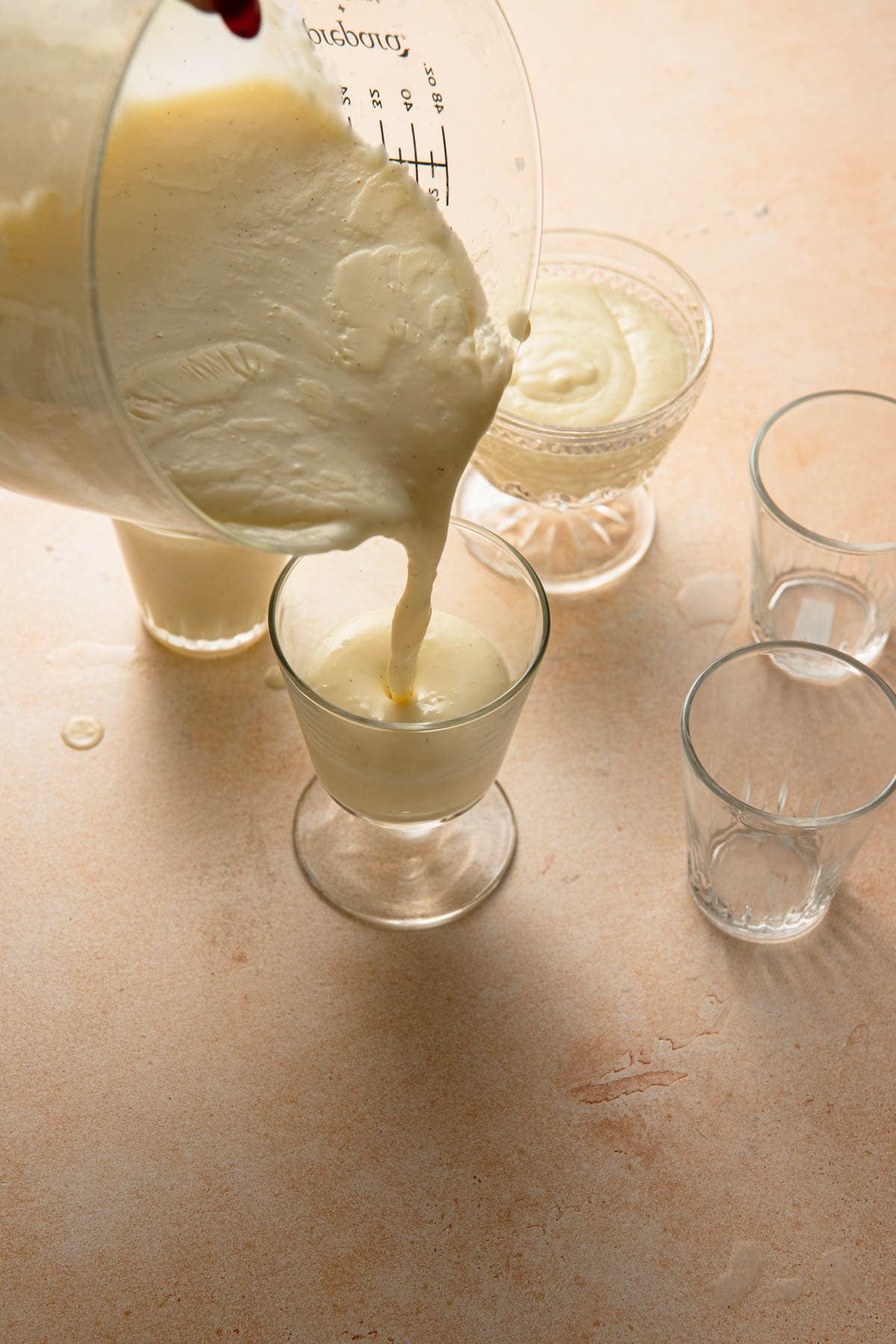 Dividing Budino between small dishes.