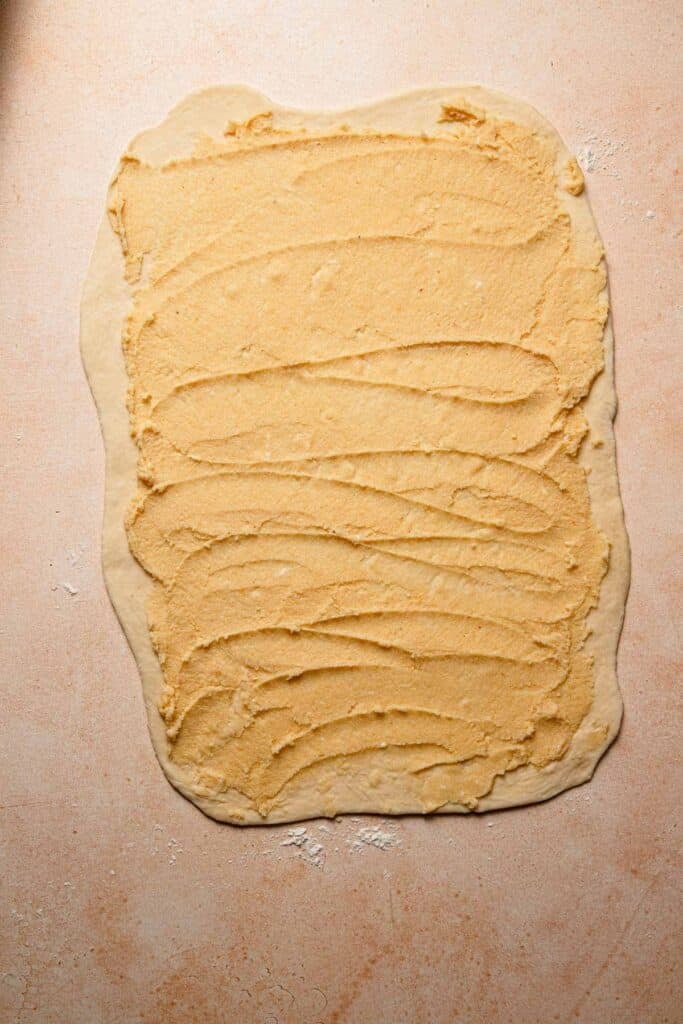 A rectangle dough topped with almonds cream.