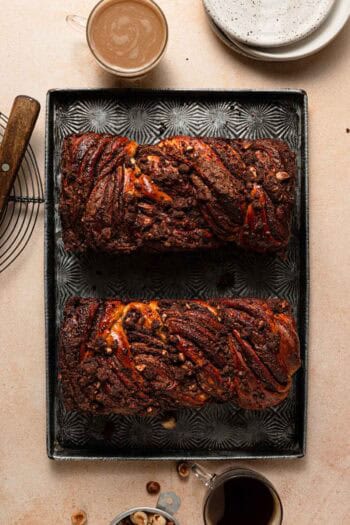 Nutella babkas on a tray with coffee next to it.