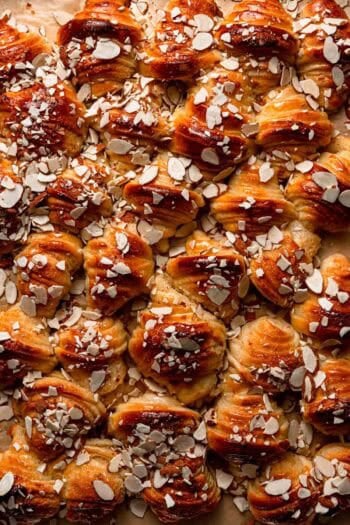 Israeli style rugelach topped with almonds.