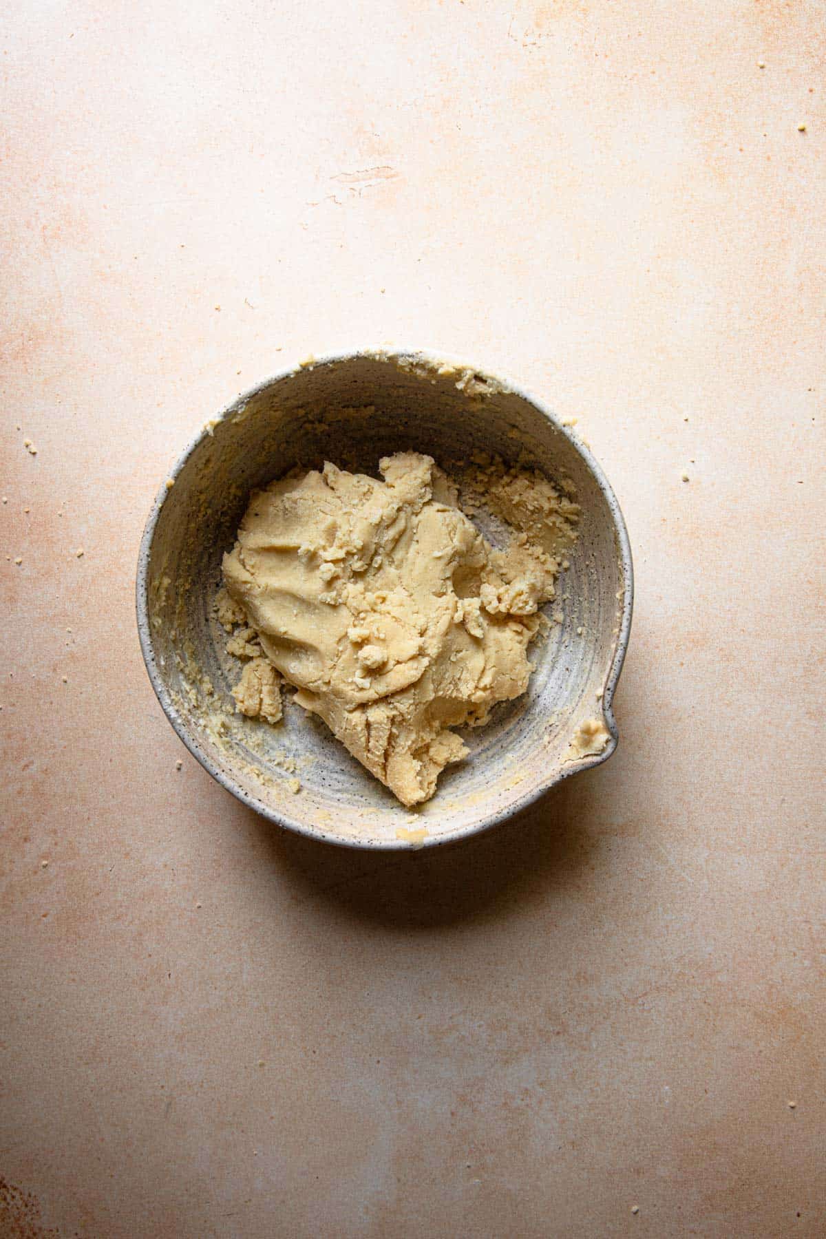 A bowl with shortbread dough.
