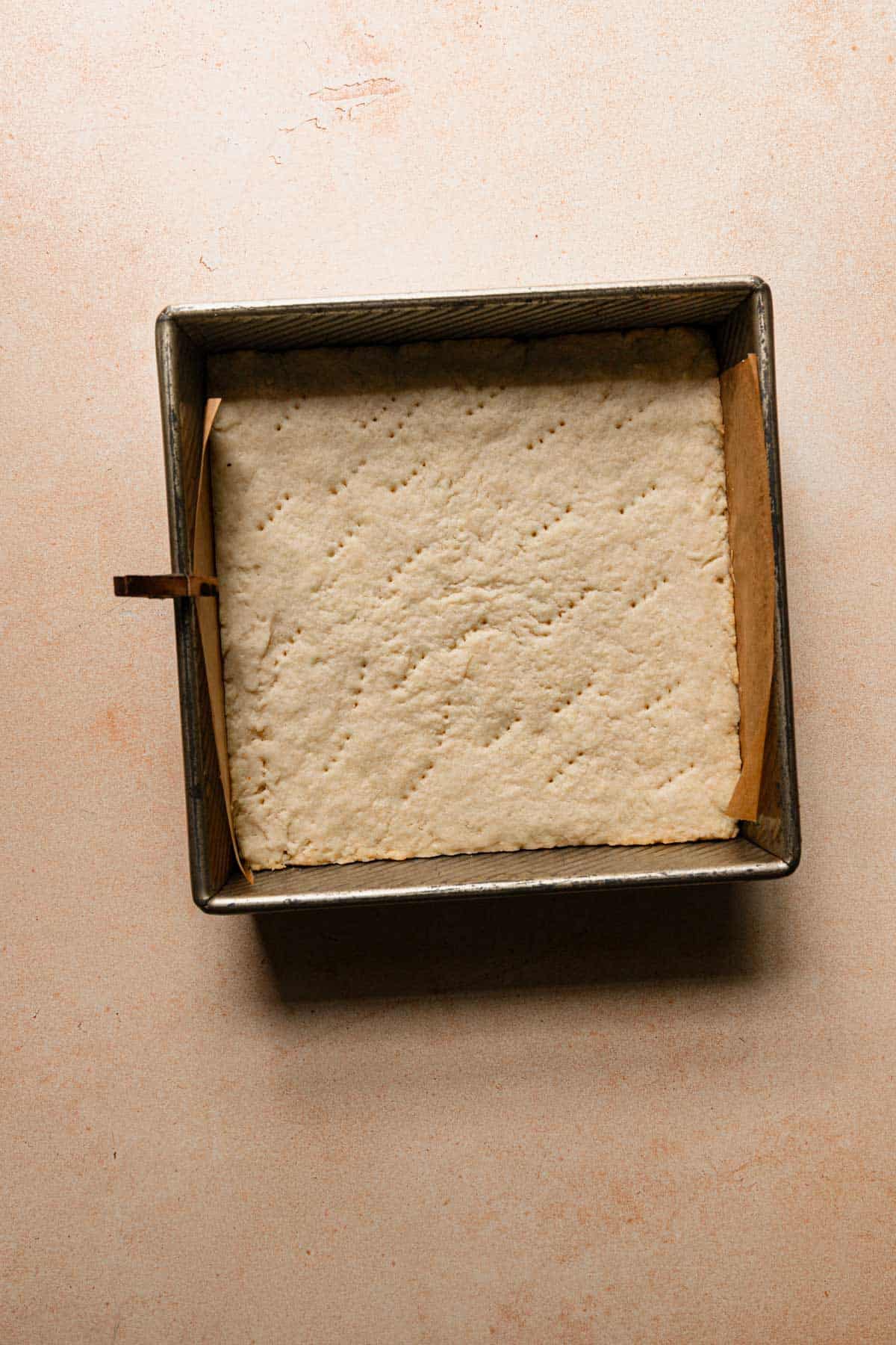 Par-baked dough in a pan.