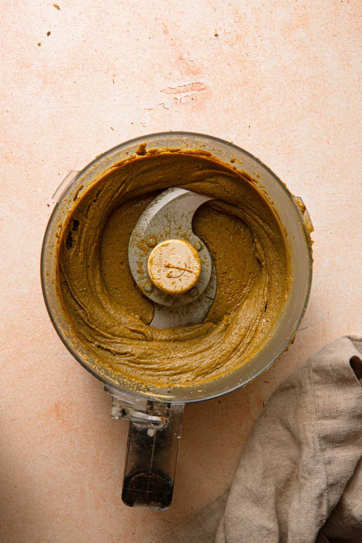 A food processor with pisrachio cream.