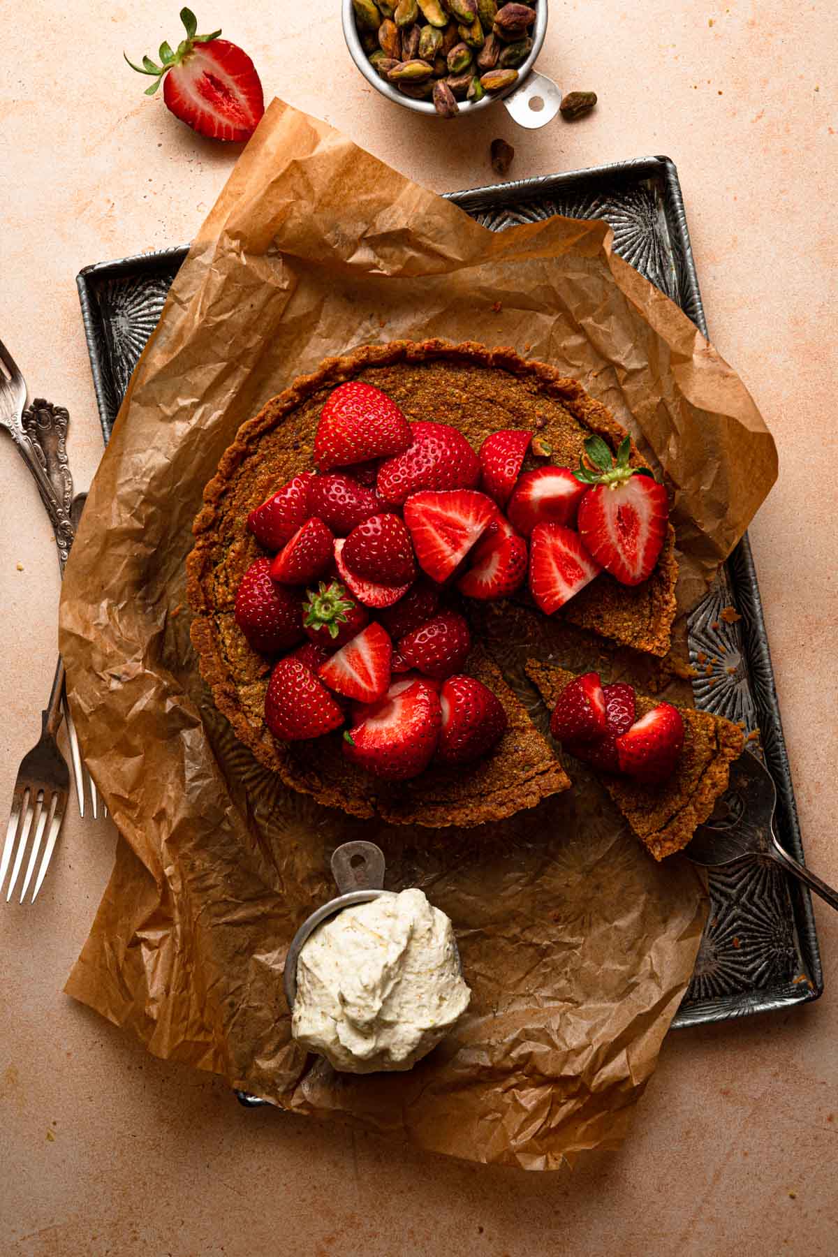 Pistachio tart topped with fresh strawberries.