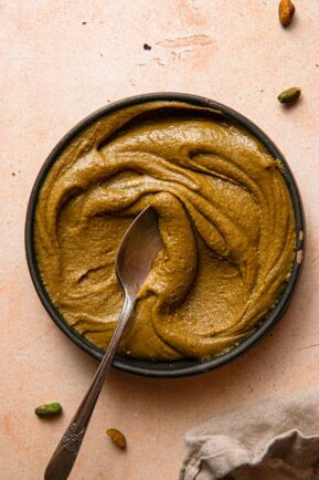 Pistachio praline paste in a bowl.