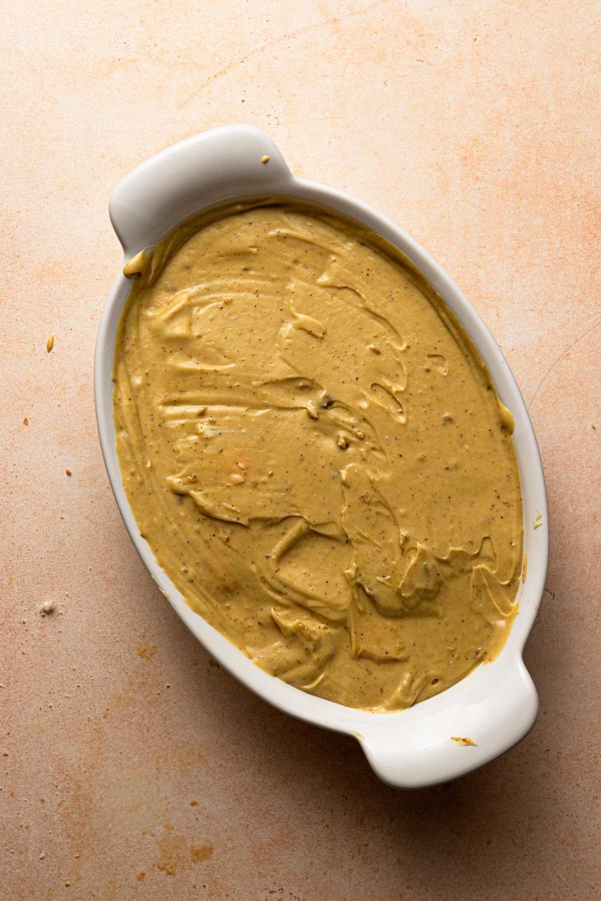 An oval dish with a pistachio cream.