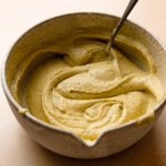 pistachio cream in a bowl with a spoon.