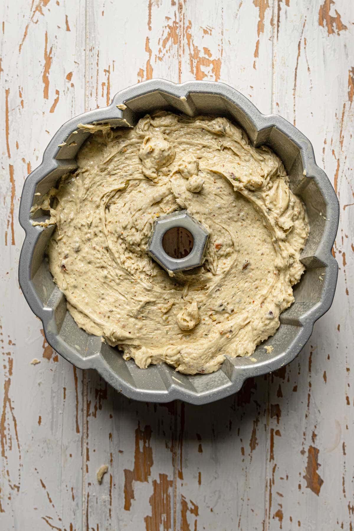 Bundt pan filled with raw batter.