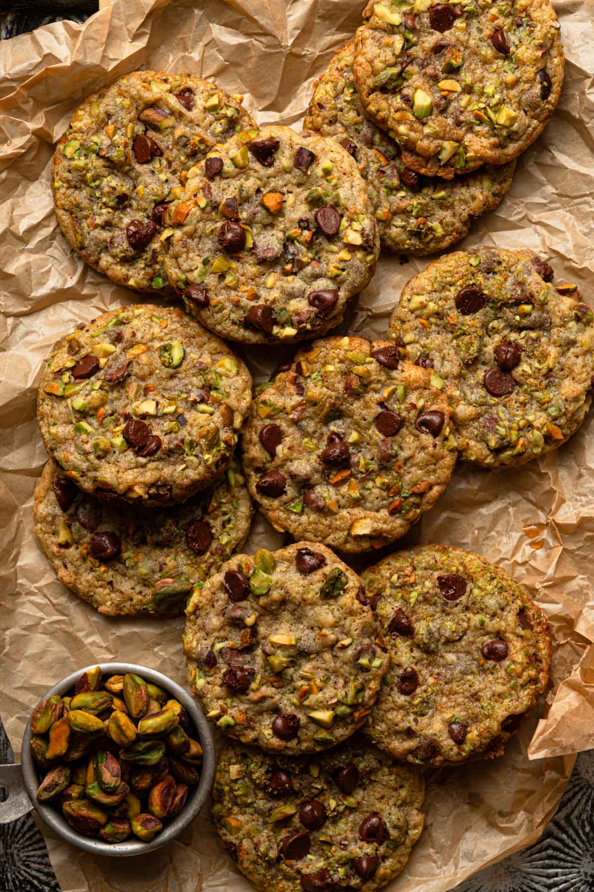 Pistachio cookies on a piece of parchment paper.