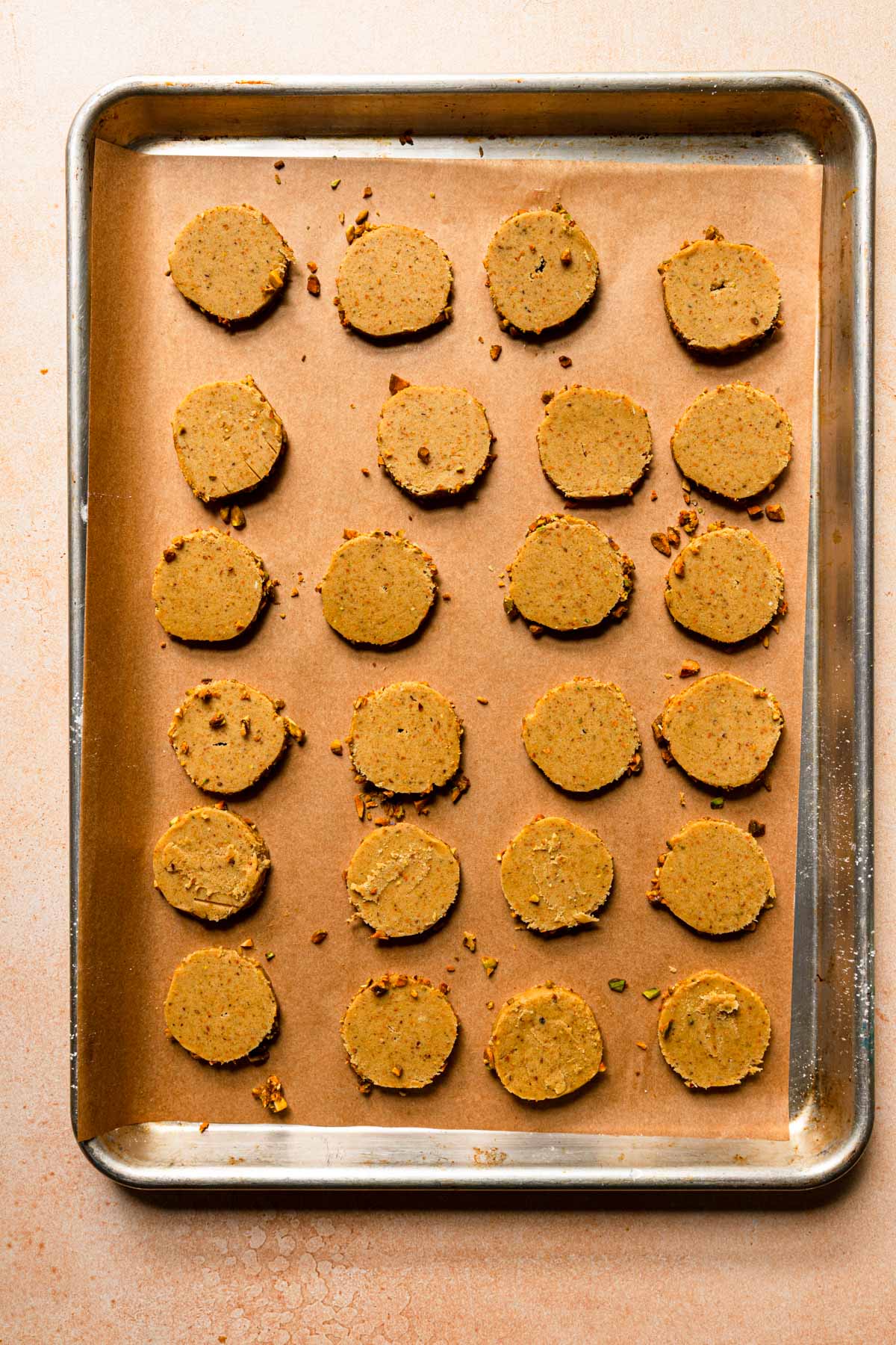 A cookie pan with raw cookies.