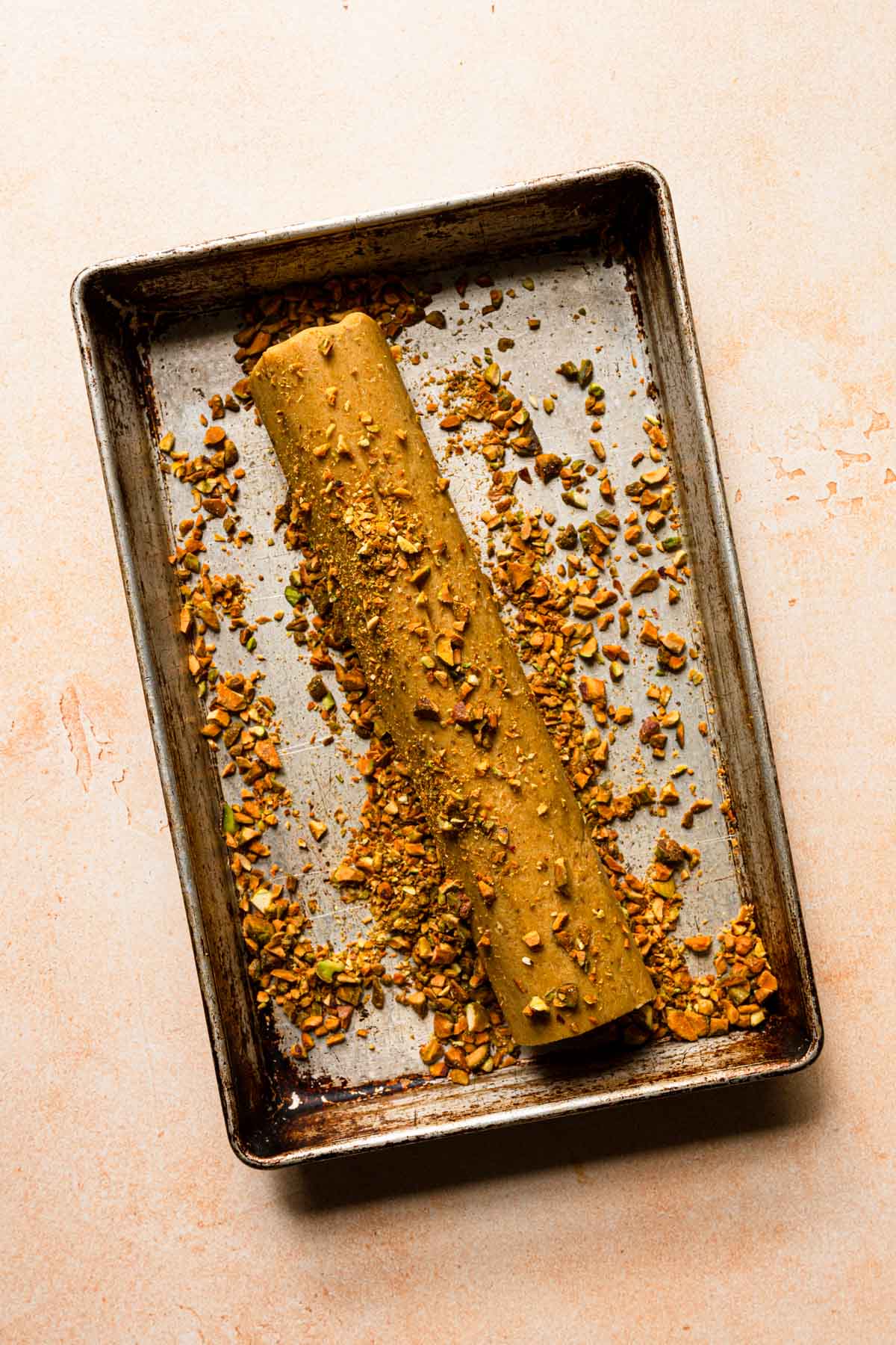 Pistachio cookie dough rolled in a chopped pistachios.