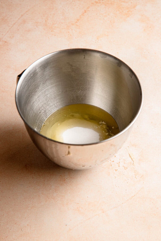 S mixing bowl with egg whites and sugar.