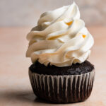 Chocolate cupcake with vanilla frosting.