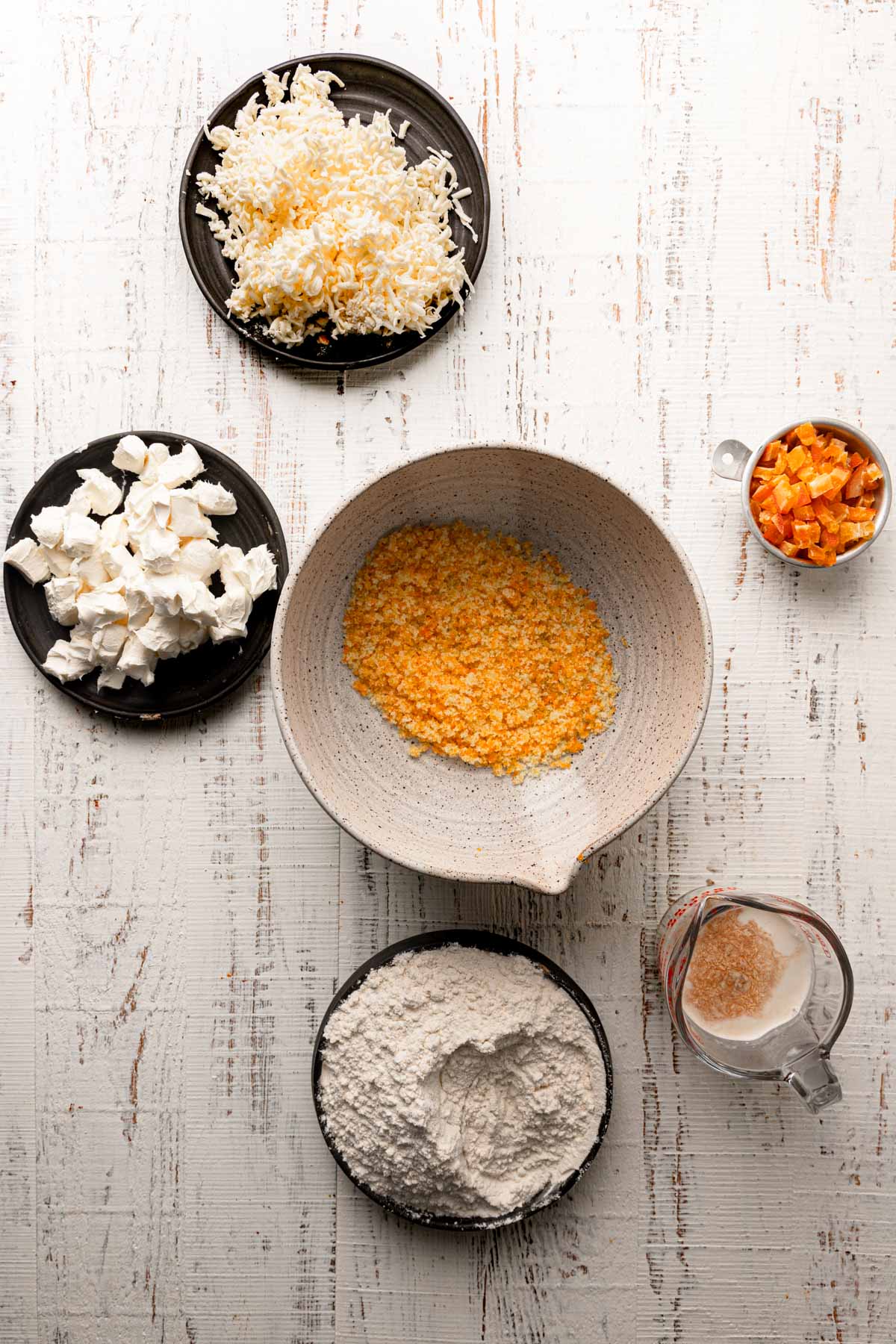 Bowls with ingredients to make orange scones.