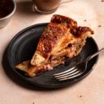 A slice of pear pie with a fork.