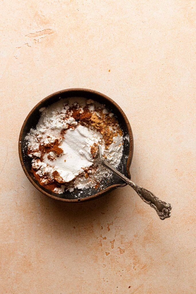 A bowl with sugar, cornstarch and spices.