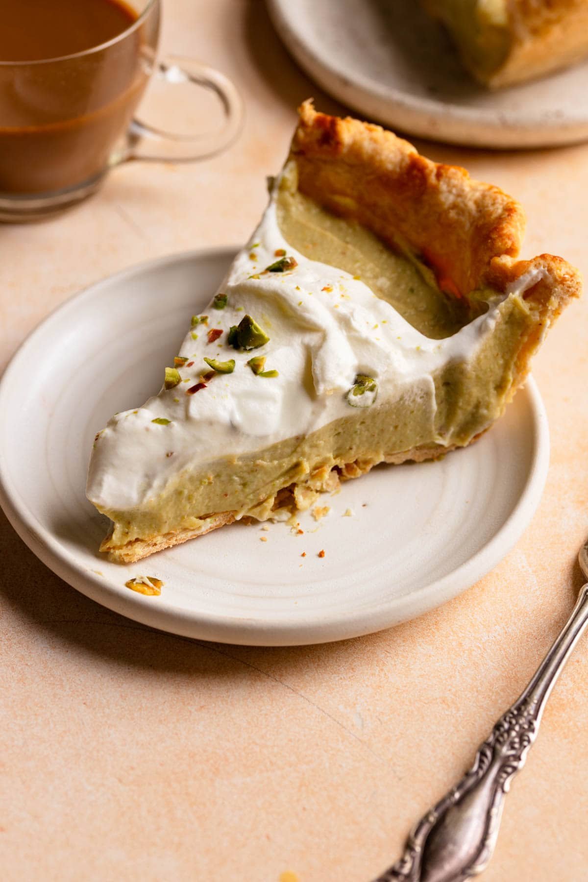 A slice of pistachio pastry cream pie.