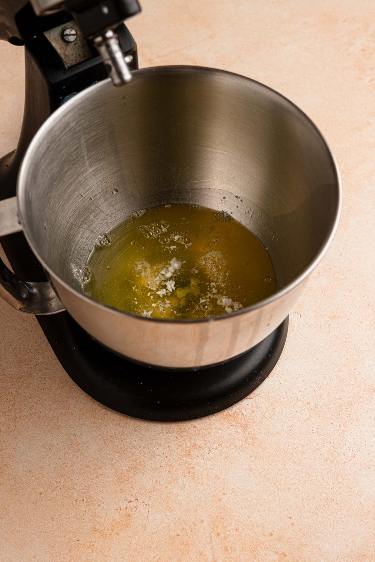 A stand mixer with egg whites and cream of tartar.
