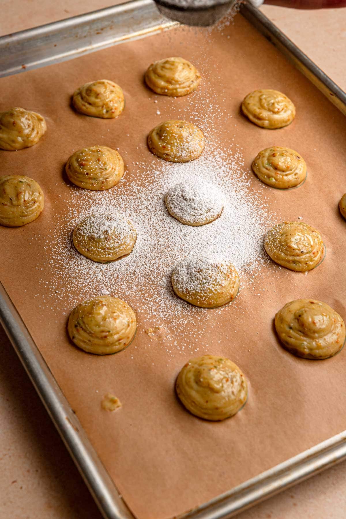 dusting choux paste dough with powdered sugar.