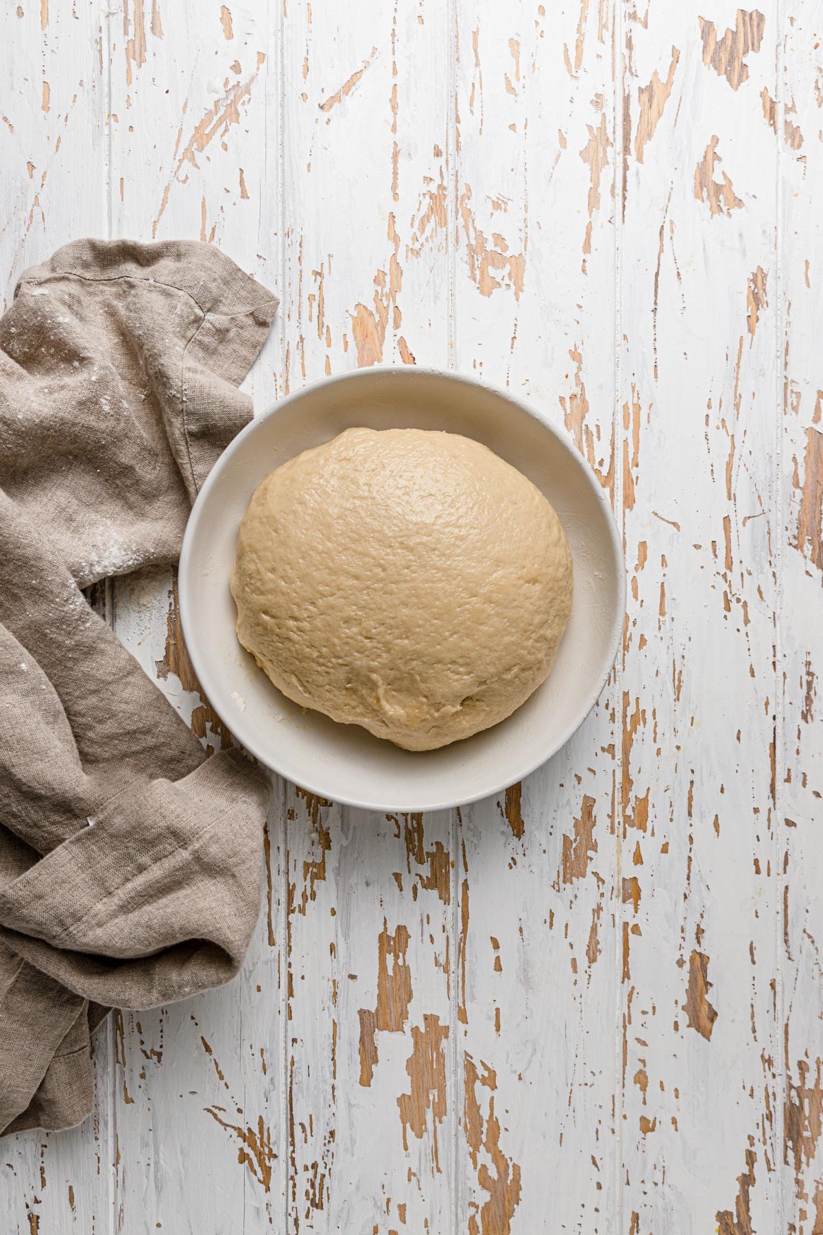 A bowl with a smooth dough.
