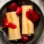 Cheese blintzes recipe with strawberry topping.