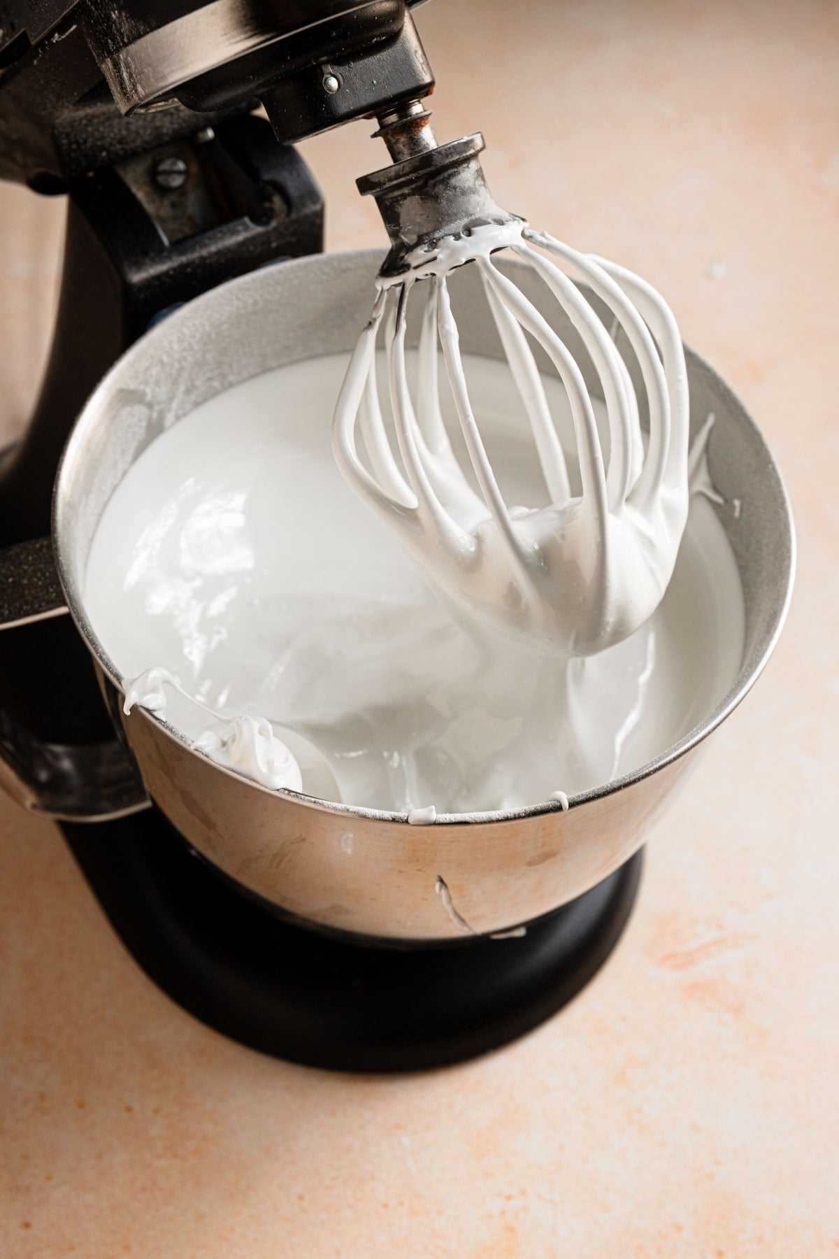 A stand mixer bowl with meringue/