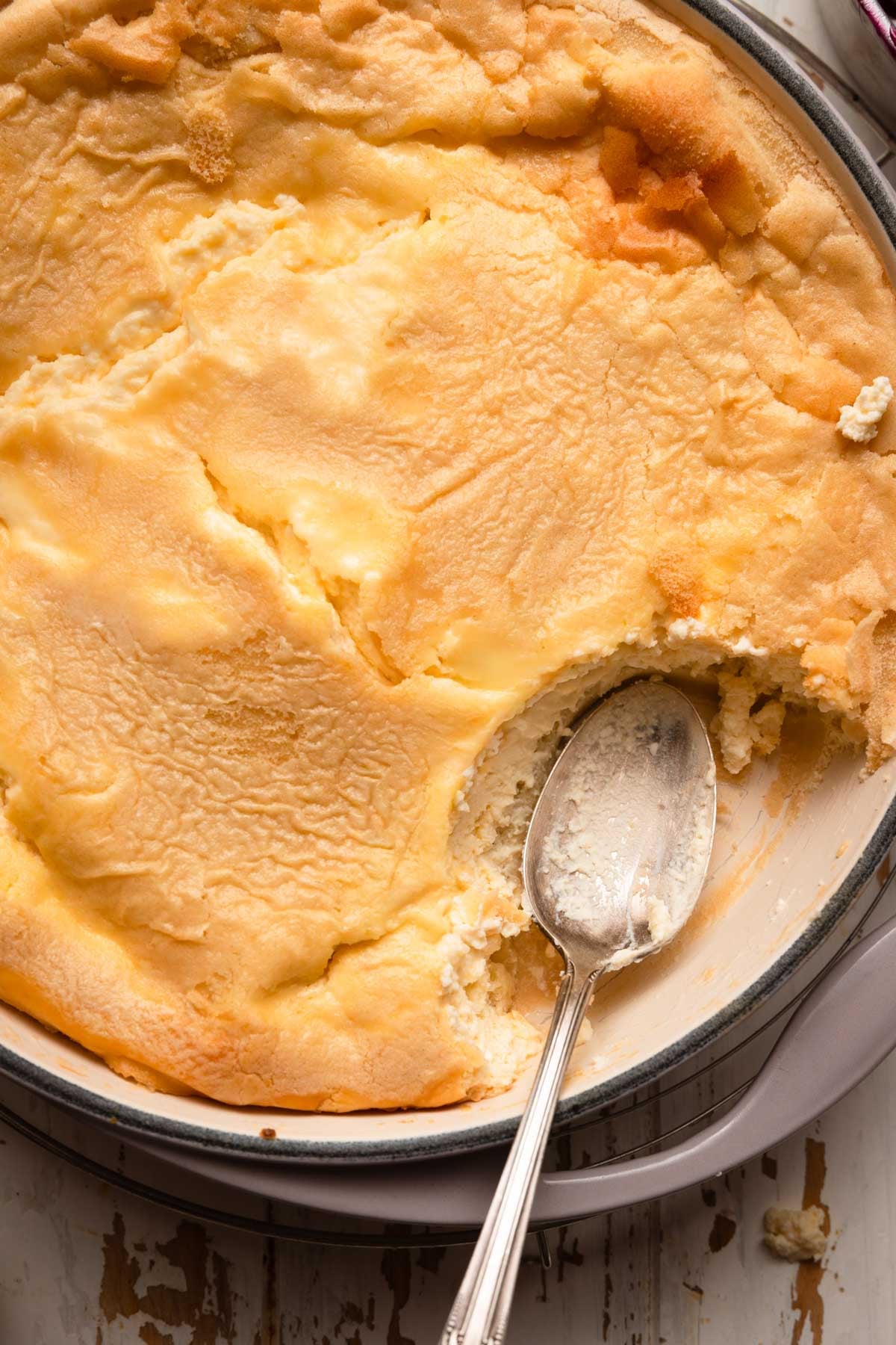 baked Blintzes casserole with a spoon.