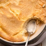 baked blintzes casserole with a spoon.