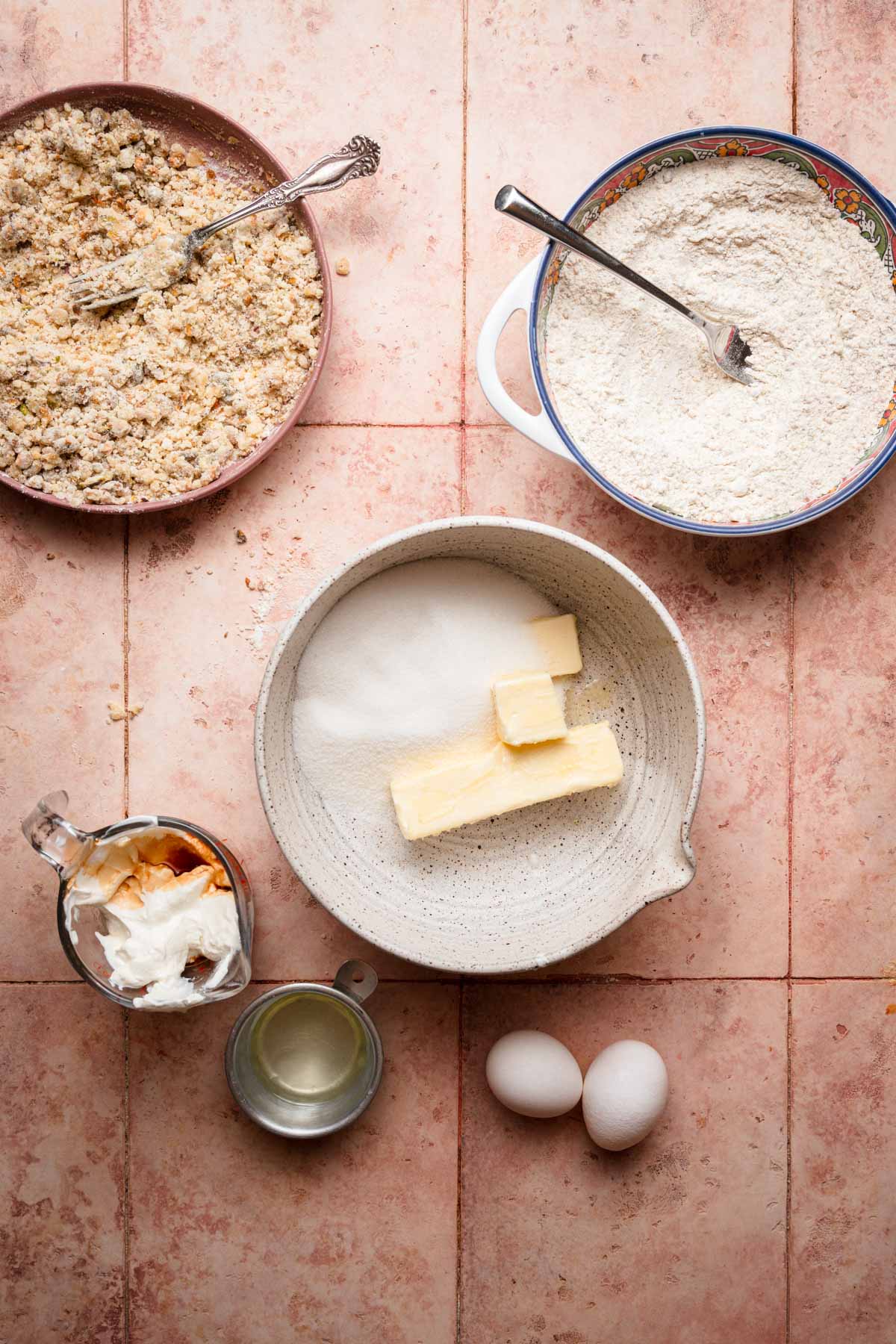 Bowls with ingredients to make cake.