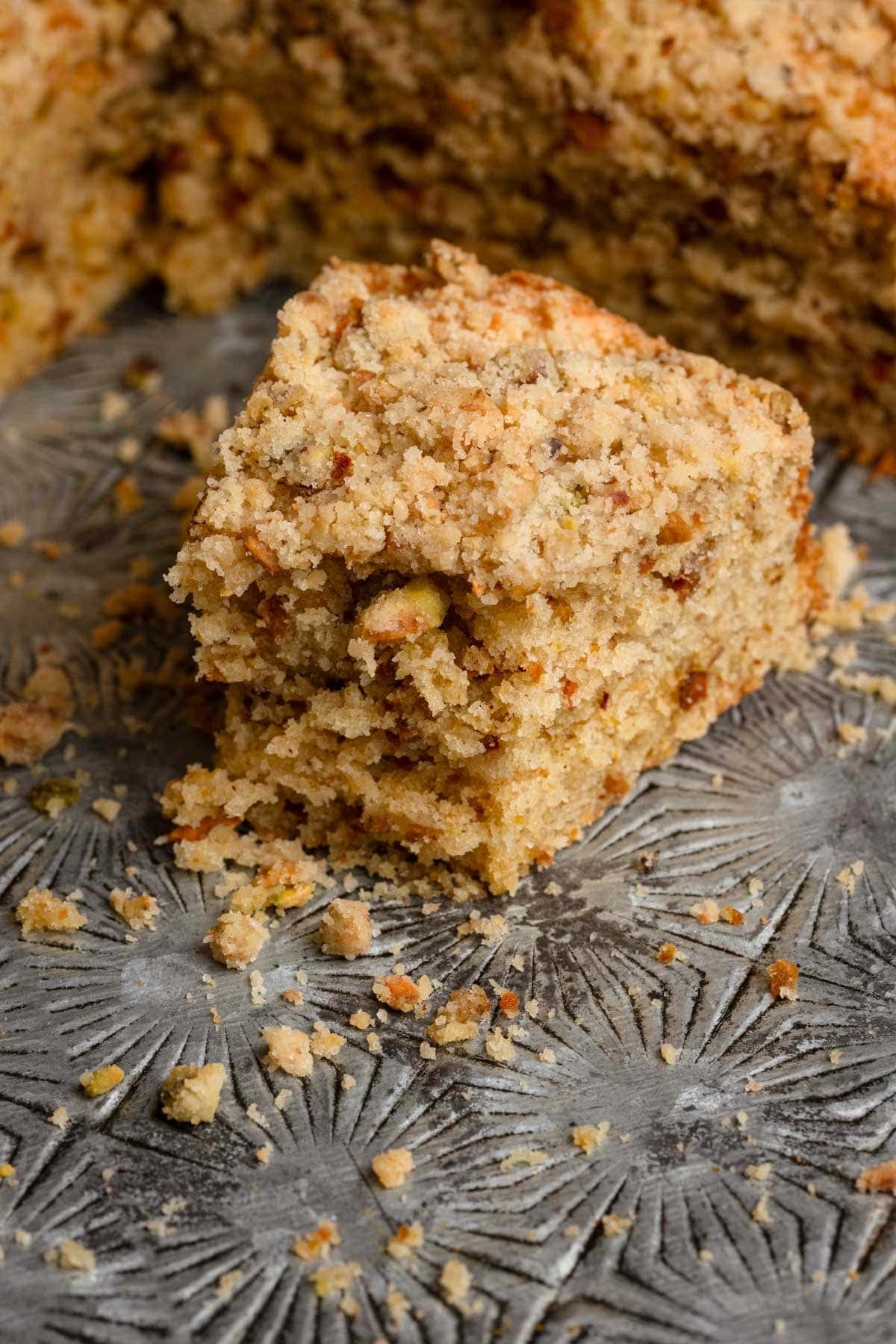 A slice of crumble pistachio cake.
