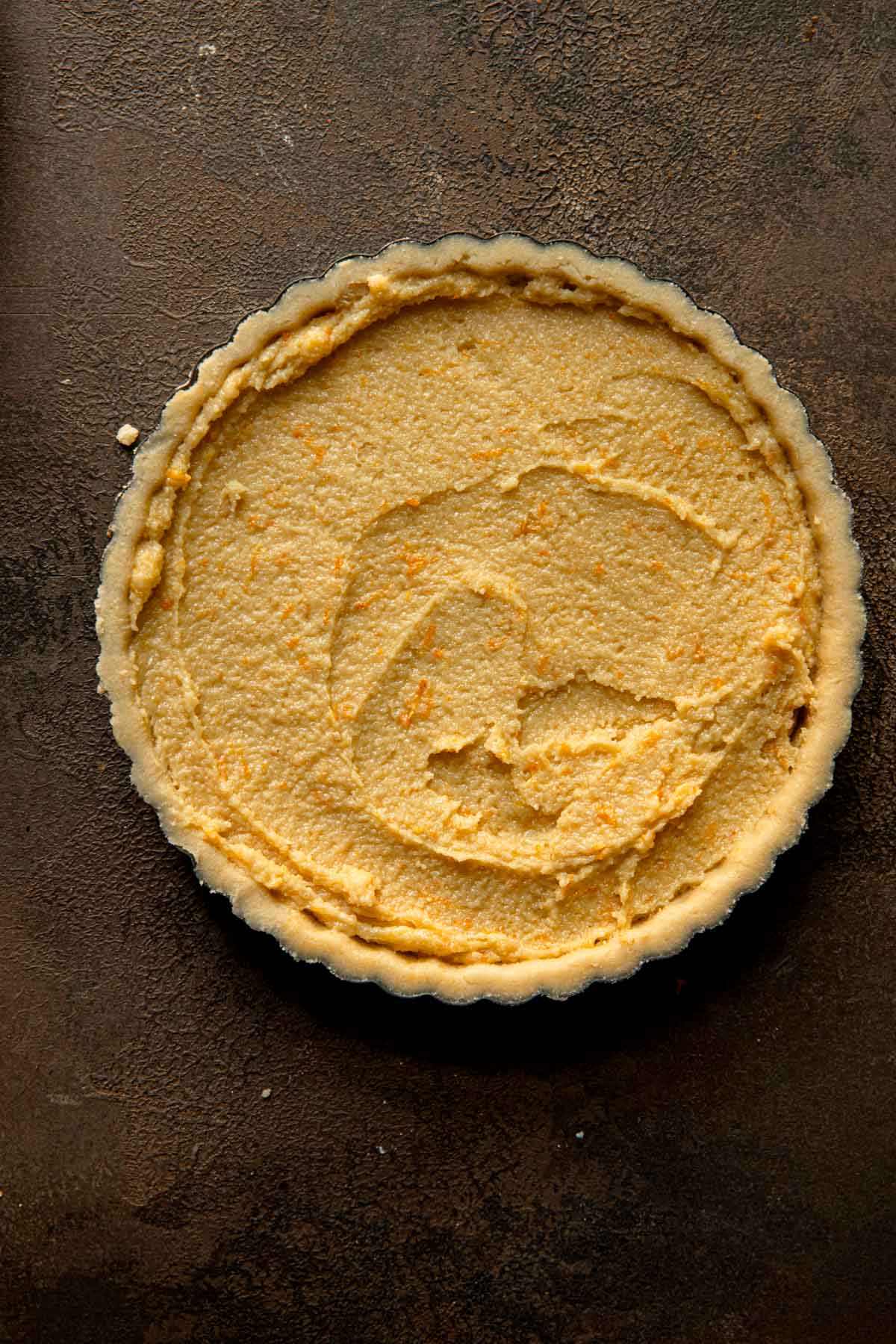 Unbaked tart filled with filling.