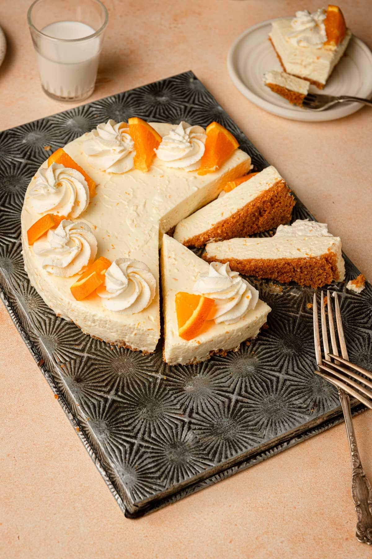 Slices orange cheesecake.