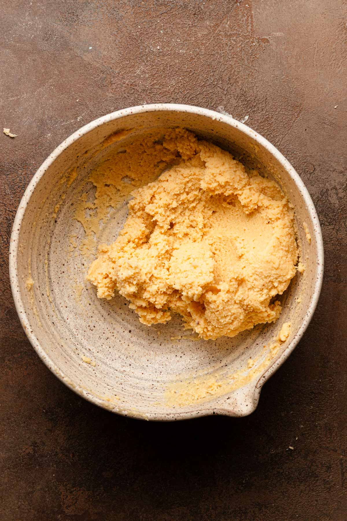 A mixing bowl with almond paste.