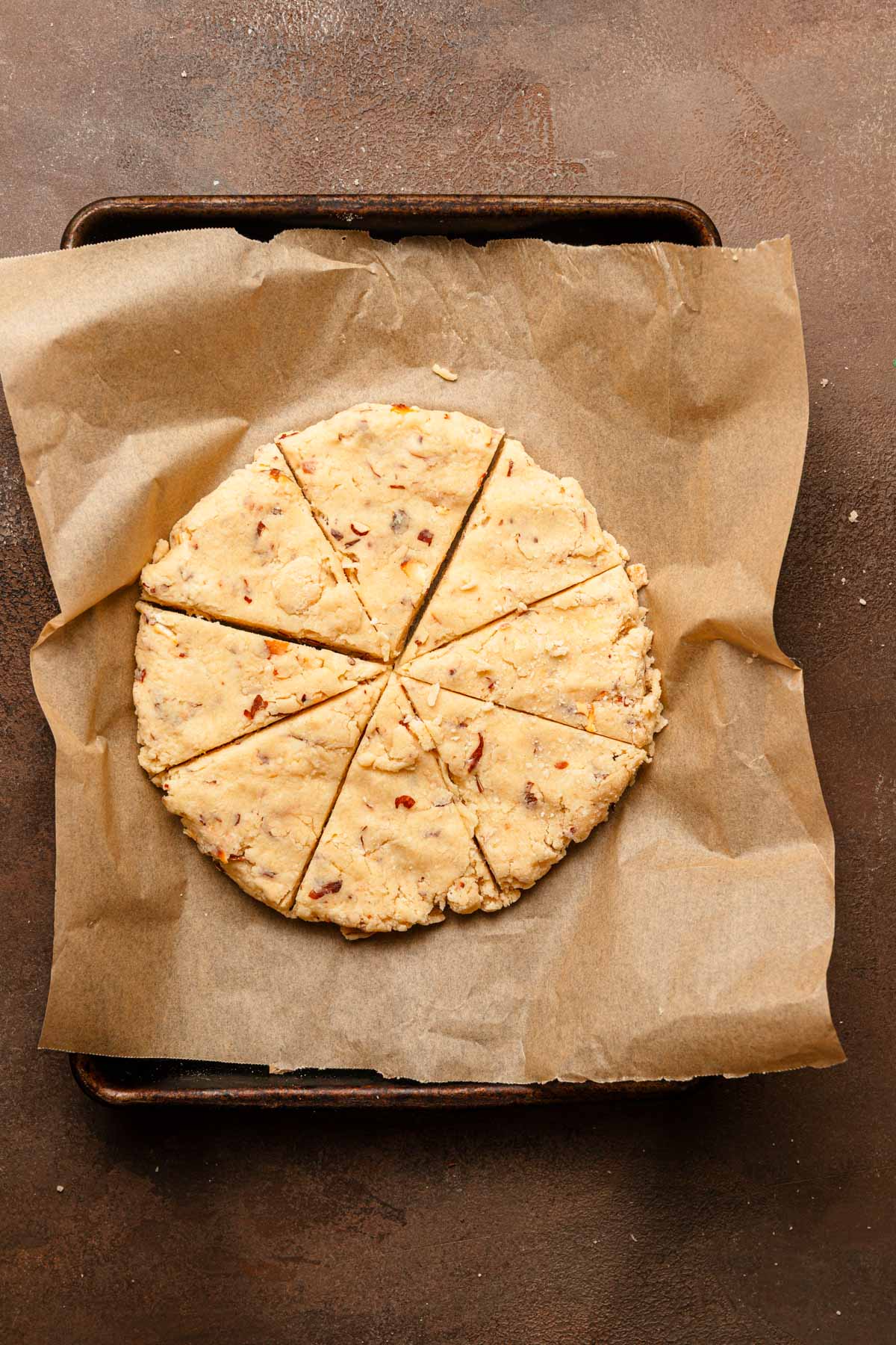 A dough circle cut into 8 triangles.