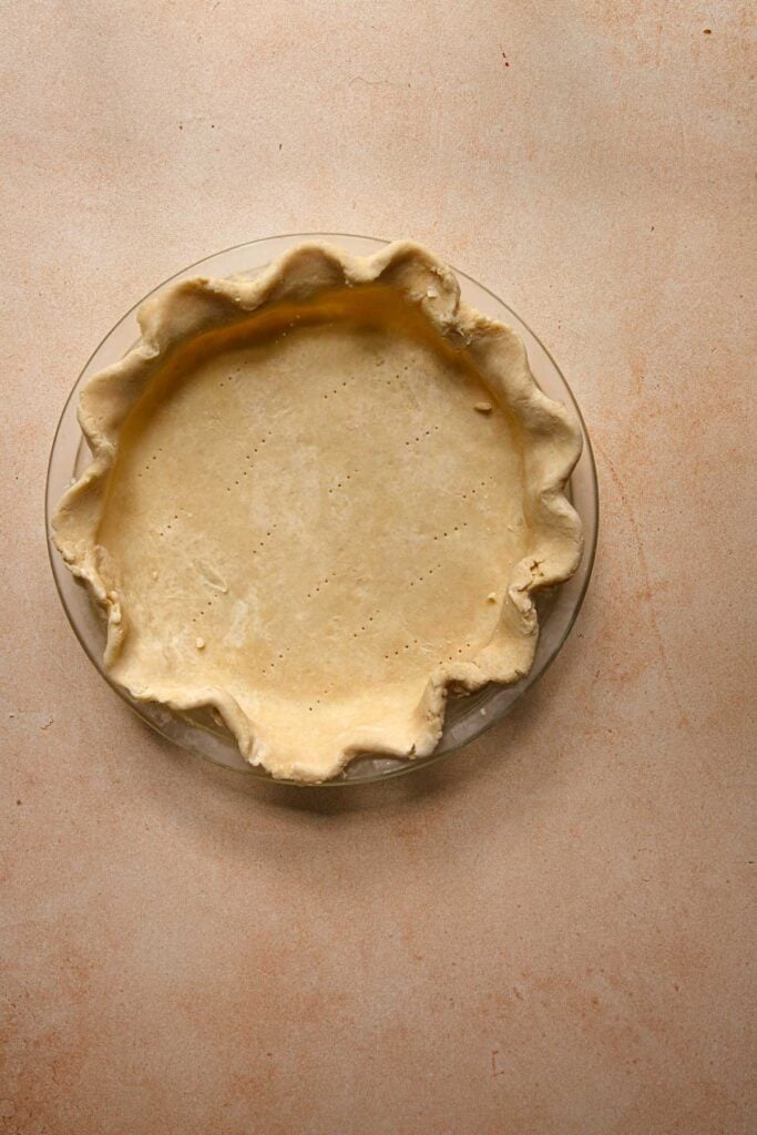 Unbaked crimped pie crust, unbaked.