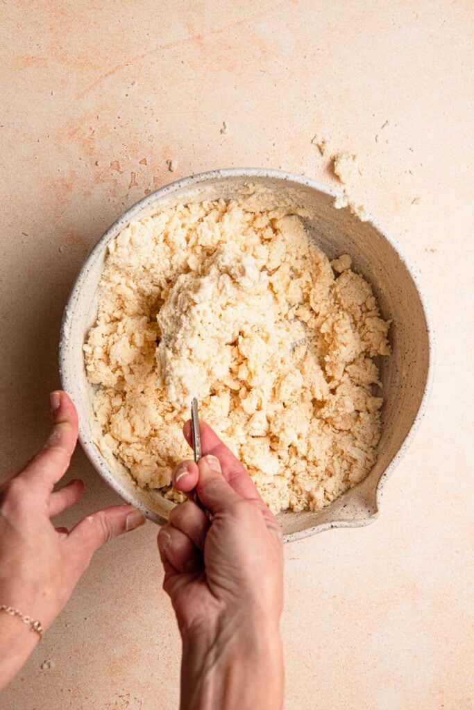 Incorporating liquids into scone dough.