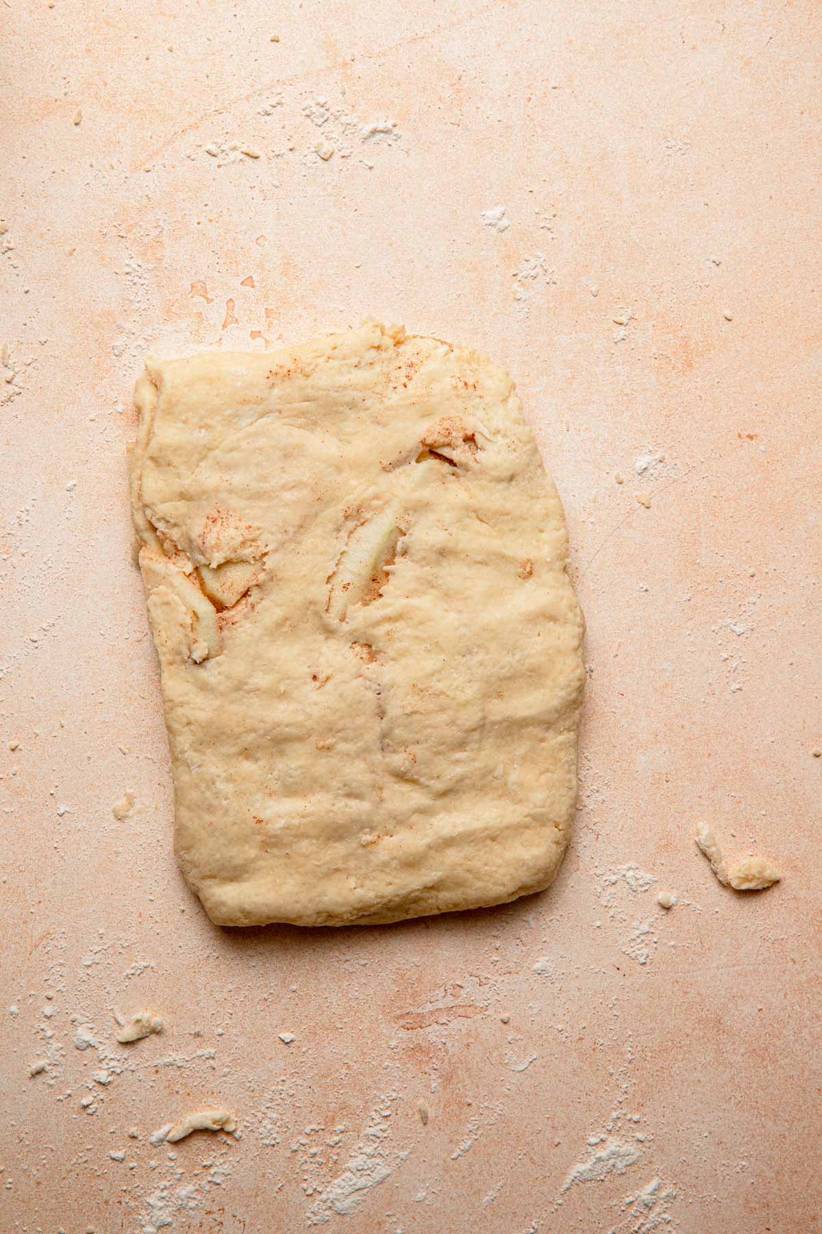 Unbaked scone dough shaped into a rectangle.